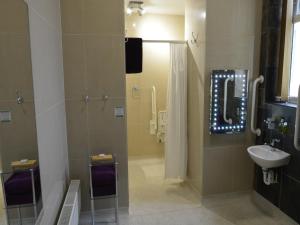 a bathroom with a shower and a sink at Wildercombe House in Ilfracombe