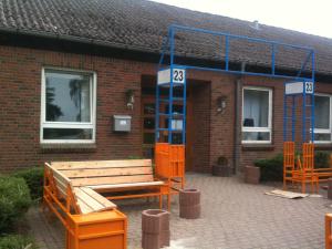 a brick building with a bench in front of it at Hostel Flensburg in Flensburg