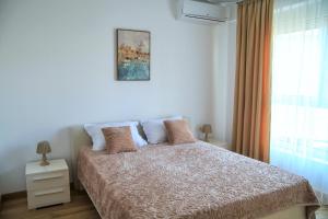 Postel nebo postele na pokoji v ubytování Apartments LM RESIDENCE