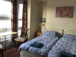 Katil atau katil-katil dalam bilik di Bayside Guest House