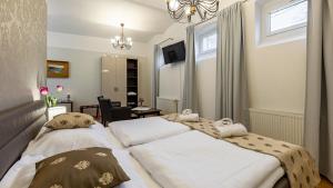 Posteľ alebo postele v izbe v ubytovaní Wellness & Spa hotel Villa Regenhart
