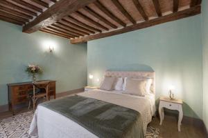 Łóżko lub łóżka w pokoju w obiekcie B&B Gli Archi