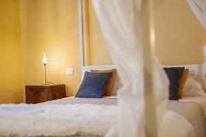 Łóżko lub łóżka w pokoju w obiekcie B&B Gli Archi