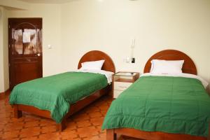 Katil atau katil-katil dalam bilik di Hotel Wayra