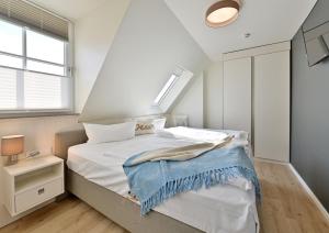 Ein Bett oder Betten in einem Zimmer der Unterkunft Hotel- & Ferienanlage Kapitäns-Häuser Breege