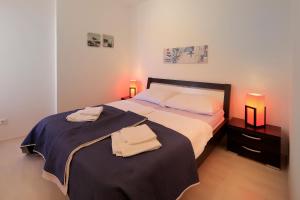 Postel nebo postele na pokoji v ubytování Apartments Luxury Living