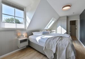 Ein Bett oder Betten in einem Zimmer der Unterkunft Hotel- & Ferienanlage Kapitäns-Häuser Breege