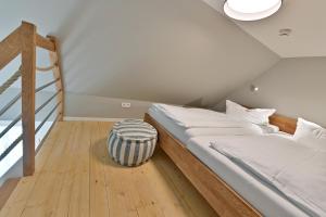 Ein Bett oder Betten in einem Zimmer der Unterkunft Hotel- & Ferienanlage Kapitäns-Häuser Breege