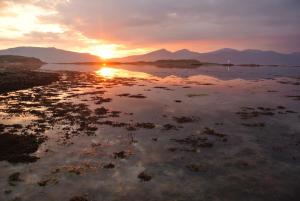 a sunset over the water with mountains in the background at The Airds Hotel and Restaurant in Port Appin