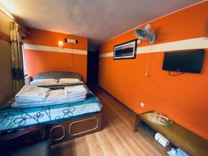 Postel nebo postele na pokoji v ubytování Souvenir Guest House