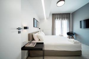 מיטה או מיטות בחדר ב-Heritage Boutique Apartments