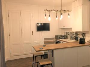 Kuchyň nebo kuchyňský kout v ubytování Le Duplex des Eclusiers + 21 fotografií