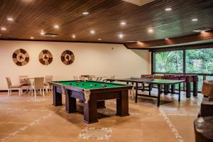 a billiard room with two tables and a pool table at Itacaré Eco Resort in Itacaré