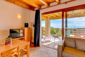 Televízia a/alebo spoločenská miestnosť v ubytovaní Relais Rosa Dei Venti -Ciao Vacanze-