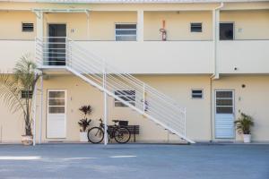 a bike parked in front of a building with a staircase at Pousada Schmitz in Florianópolis