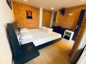 Postel nebo postele na pokoji v ubytování Souvenir Guest House