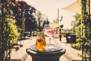 a glass of fruit and a drink on a table at The Bentley Brook Inn in Thorpe