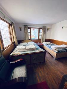 Postel nebo postele na pokoji v ubytování Souvenir Guest House