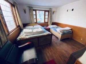 Postel nebo postele na pokoji v ubytování Souvenir Guest House
