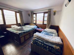 Postel nebo postele na pokoji v ubytování Souvenir Guest House