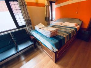 Postel nebo postele na pokoji v ubytování Souvenir Guest House