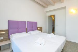 Posteľ alebo postele v izbe v ubytovaní Relais Rosa Dei Venti -Ciao Vacanze-