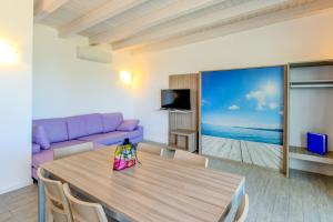 Televízia a/alebo spoločenská miestnosť v ubytovaní Relais Rosa Dei Venti -Ciao Vacanze-
