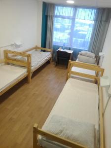 
Кровать или кровати в номере B&B Hostel на Мамина-Сибиряка 58

