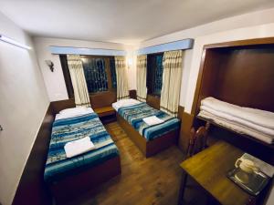 Postel nebo postele na pokoji v ubytování Souvenir Guest House