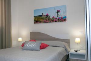 A bed or beds in a room at Le Dimore di Otranto