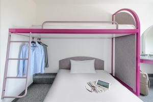 Postel nebo postele na pokoji v ubytování ibis budget Berlin Hoppegarten