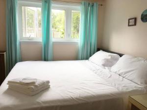 Cama ou camas em um quarto em Freeda's Place