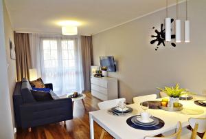 Posezení v ubytování Apartamenty Sun&Fun Rezydencja Parkowa Nadrzeczna 3D i 3E -blisko centrum, dworca PKP w otoczeniu zieleni