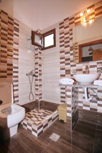a bathroom with a toilet and a sink at Maria Studios in Neo Klima +37 photos