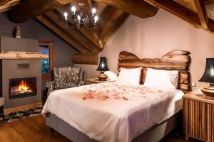 A bed or beds in a room at Mythica Chalet