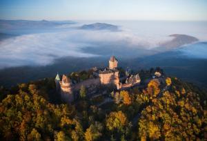 a castle on top of a hill in the clouds at VIEUX SCHILIK / Parking / Tram / Parlement / Proche Strasbourg Centre in Schiltigheim