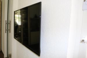 a mirror on the side of a wall at Zur Alpenruhe in Seeboden