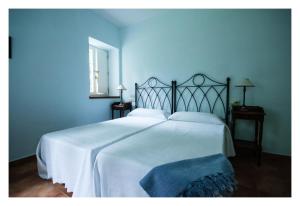 Cama o camas de una habitación en Hotel Rural La Casa del Burrero