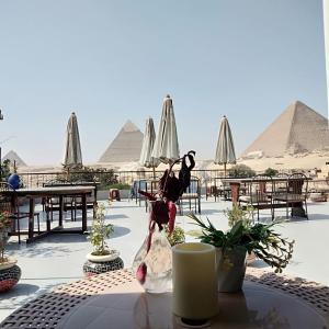 a table with a view of the pyramids at Pyramids View Inn in Cairo