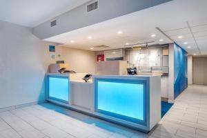 an empty office with two blue counters in a room at Holiday Inn Express Ramsey Mahwah, an IHG Hotel in Ramsey