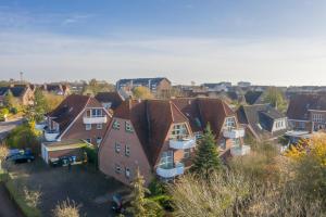 an aerial view of a residential neighborhood with houses at Meer Appartement in Büsum