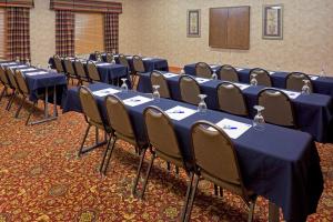 a row of tables and chairs in a room at Holiday Inn Express Syracuse-Fairgrounds, an IHG Hotel in Warners