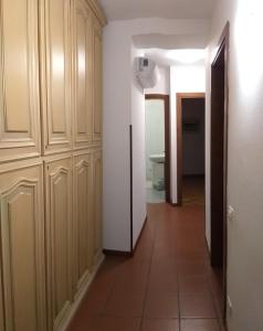 a hallway of a room with wooden cabinets at Casa Vacanze MODENA in Costermano