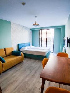 Posezení v ubytování Новый Гудаури Loft 2