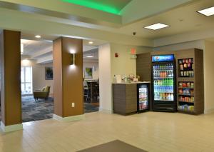 a lobby of a store with a drink refrigerator at Holiday Inn Hotel & Suites Rochester - Marketplace by IHG in Rochester