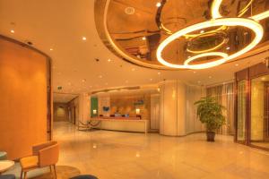 a lobby of a building with a chandelier at Holiday Inn Express Shanghai Zhenping, an IHG Hotel in Shanghai