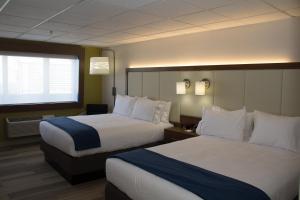 Postel nebo postele na pokoji v ubytování Holiday Inn Express Salt Lake City Downtown by IHG