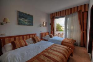 Postel nebo postele na pokoji v ubytování Hotel Trogirski Dvori