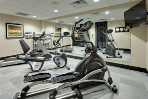 a gym with cardio equipment in a hotel room at Holiday Inn Express & Suites Northeast by IHG in York