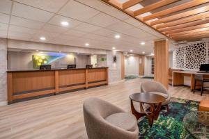 a lobby with chairs and a waiting room at Holiday Inn & Suites Parsippany Fairfield, an IHG Hotel in Parsippany